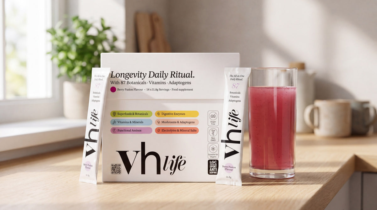 The VH Life box with a sachet and a glass of the berry drink on a kitchen worktop