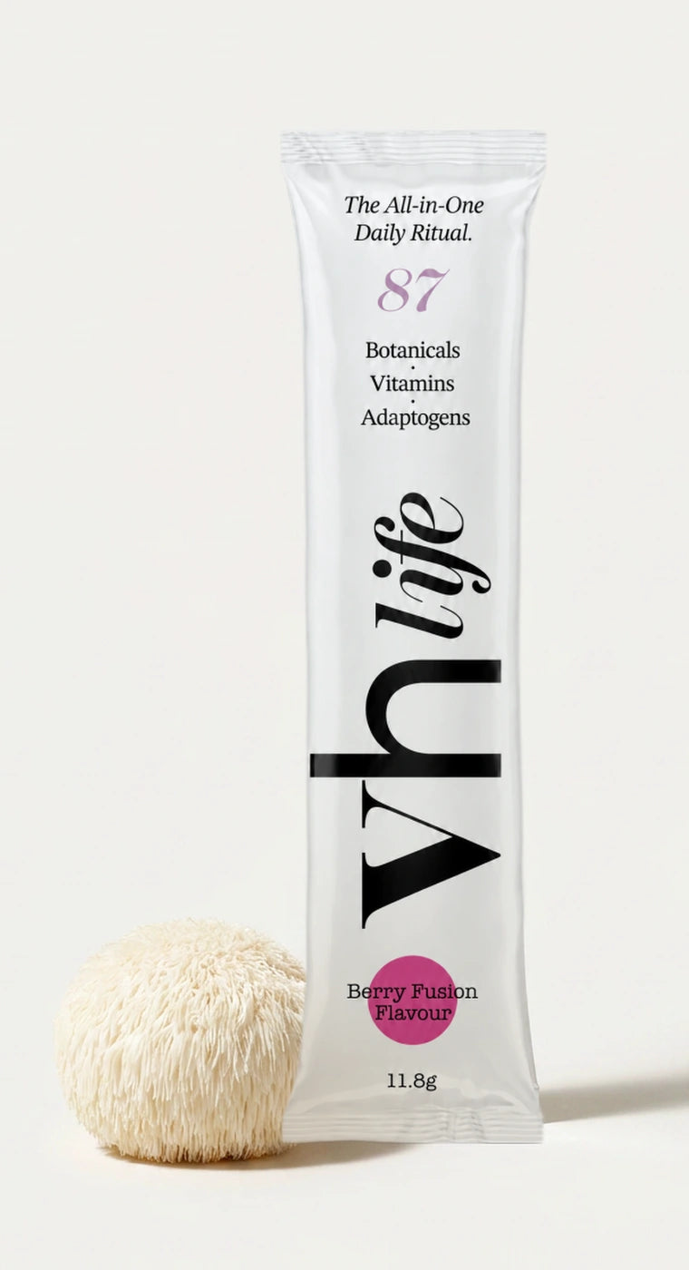 A VH Life Berry Fusion sachet photographed beside a whole lion's mane mushroom